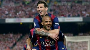 Alves y Messi celebrando en el Barcelona